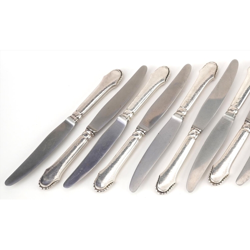 435 - Svend Toxvaerd, set of twelve Danish silver handled knives with stainless steel blades, 20.5cm in le... 