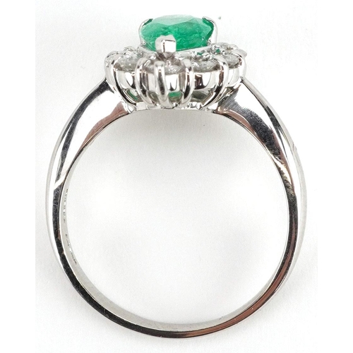  A platinum pear cut emerald and diamond cluster ring, the emeralds approximately 1.12 carat, total d... 