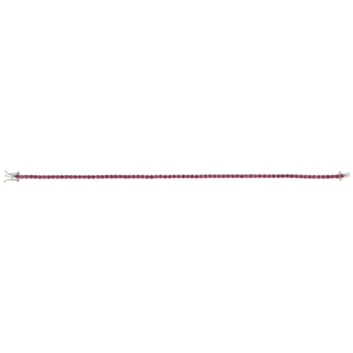 3022 - An 18ct white gold ruby line bracelet, total ruby weight approximately 3.21 carat, 17cm in length, 7... 