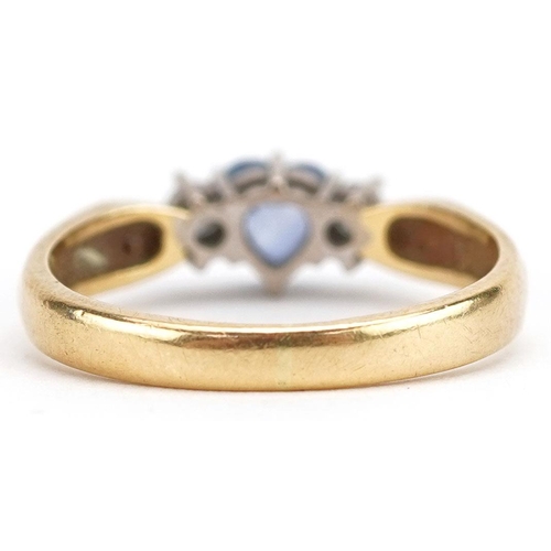 3042 - An 18ct gold sapphire love heart and diamond three stone ring, size O/P, 4.2g.