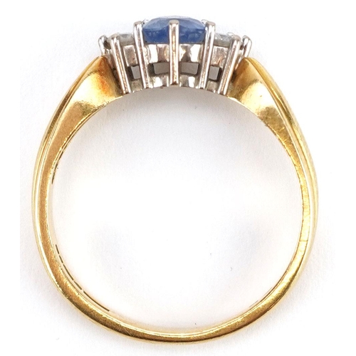 3042 - An 18ct gold sapphire love heart and diamond three stone ring, size O/P, 4.2g.