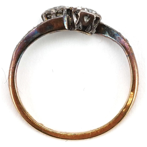 3035 - An antique 18ct gold and platinum diamond crossover ring, total diamond weight approximately 0.50 ca... 