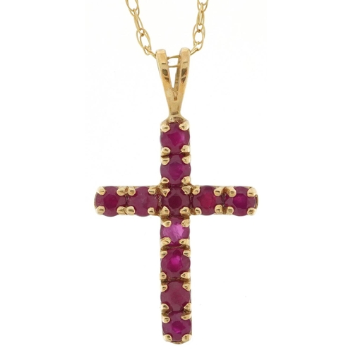 3073 - A 9ct gold pink spinel cross pendant on a 9ct gold necklace, 2.6cm high and 46cm in length, total 1.... 