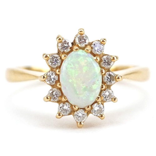 An 18ct gold cabochon opal and diamond cluster ring, size N, 3.5g.