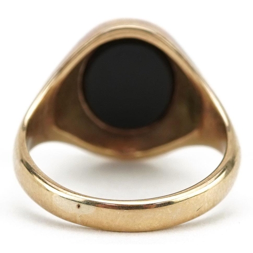 3031 - A 9ct gold and black onyx masonic signet ring, size Q/R, 6.3g.