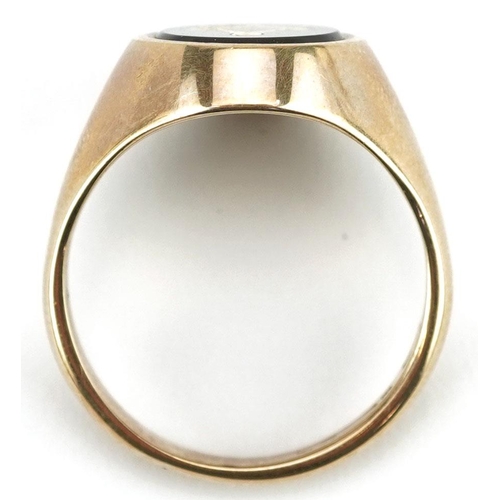 3031 - A 9ct gold and black onyx masonic signet ring, size Q/R, 6.3g.