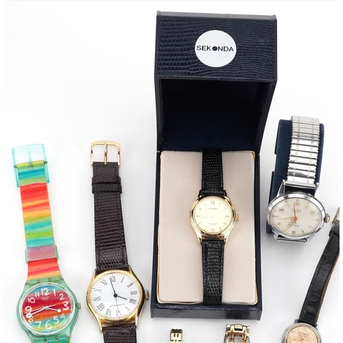 3319 - A group of various gentlemen's and ladies wristwatches to include Sekonda, Swatch, Wirz and Yeoman.