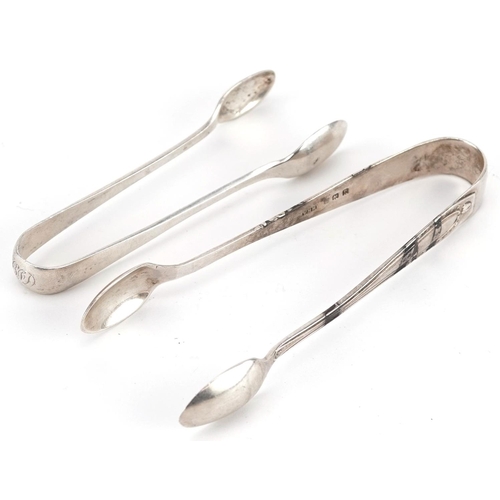 475 - A George V silver pair of sugar tongs, Birmingham 1926 by William Hair Haseler, together with anothe... 