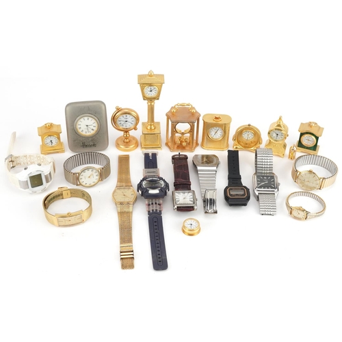 3338 - A collection of miniature gilt brass clocks and wristwatches including Accurist, Limit and Harrods.