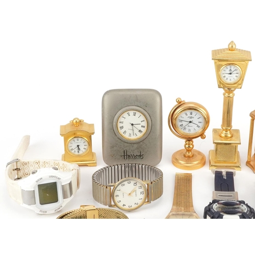 3338 - A collection of miniature gilt brass clocks and wristwatches including Accurist, Limit and Harrods.