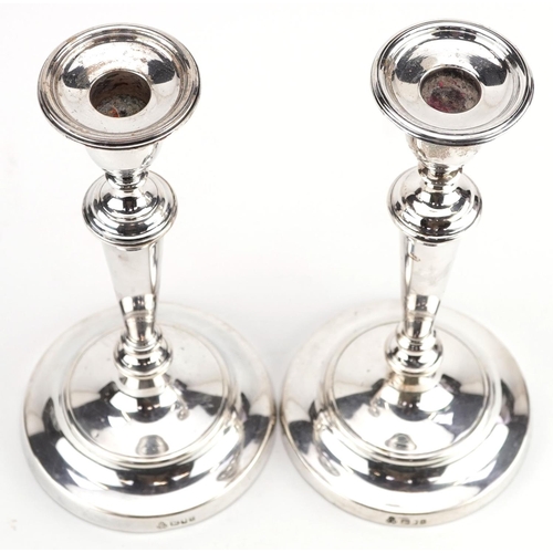 405 - M C Hersey & Son Ltd, a pair of large Elizabeth II silver tapering candlesticks with circular bases,... 