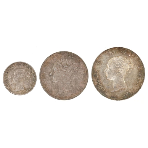 2065 - A Queen Victoria 1886 part Maundy set comprising one penny, three pence and fourpence in uncirculate... 