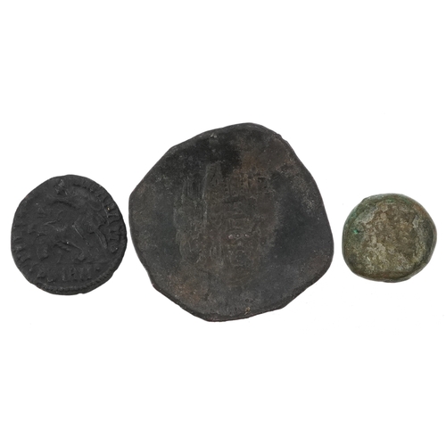 2074 - Three ancient bronze coins to include two Roman and one Byzantine, the largest 3cm in diameter.