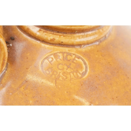 1553 - A Bourne Denby stoneware flagon, dated 1937 together with a similar Price of Bristol stoneware flago... 