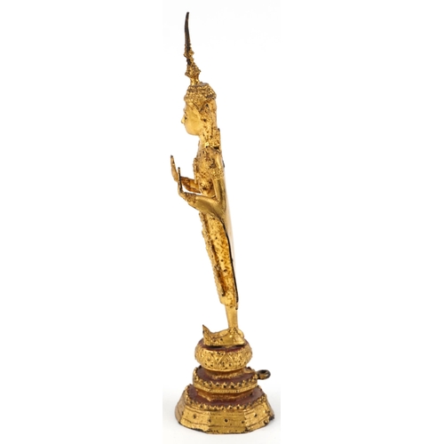 253 - A Thai gilt bronze standing buddha, 20th century, H-31cm