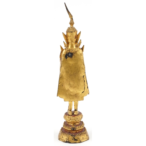 253 - A Thai gilt bronze standing buddha, 20th century, H-31cm