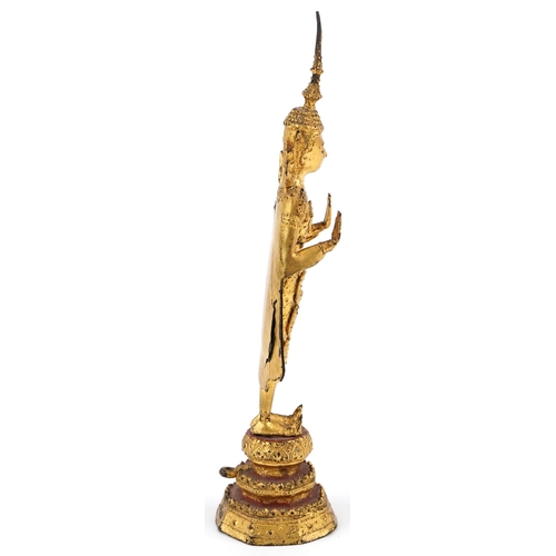 253 - A Thai gilt bronze standing buddha, 20th century, H-31cm