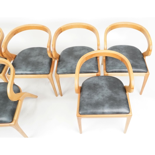 1015 - A set of six modern Nana solid ash dining chairs, with grey leather overstuffed seats, raise on tape... 