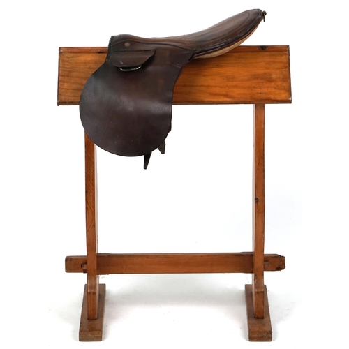 1144 - A small brown leather 16 inch saddle.