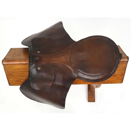 1144 - A small brown leather 16 inch saddle.