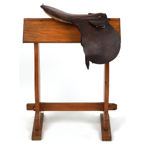 1144 - A small brown leather 16 inch saddle.