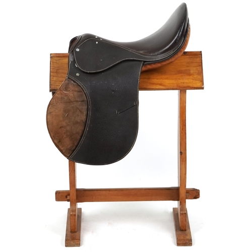 1150 - A brown leather 18 inch saddle.