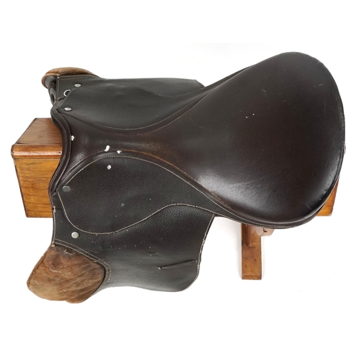 1150 - A brown leather 18 inch saddle.