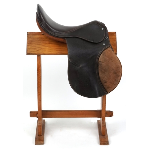 1150 - A brown leather 18 inch saddle.