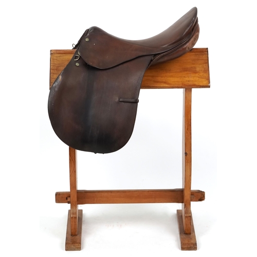 1147 - An F.E. Gibson Saddler Ltd brown leather 17 inch saddle.