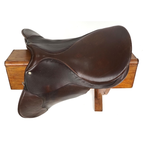 1145 - An Equestrian Manufacturing and Supply brown leather 16 inch saddle.