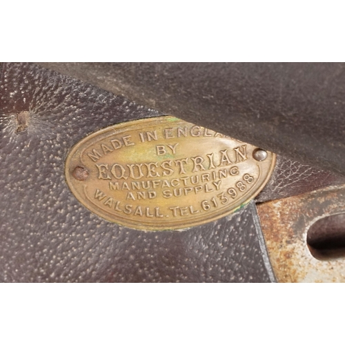 1145 - An Equestrian Manufacturing and Supply brown leather 16 inch saddle.