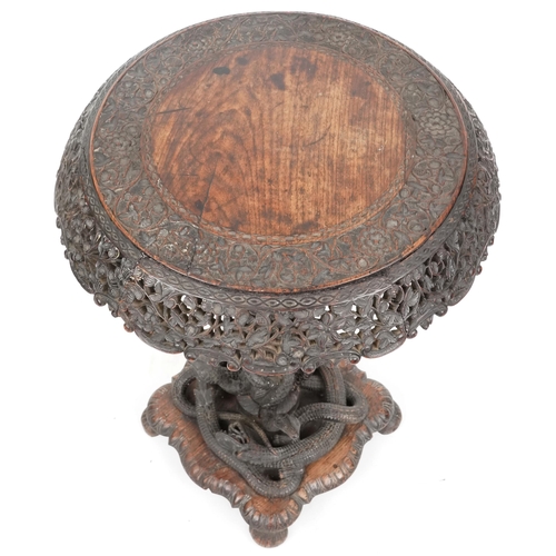  A good 19th century Anglo-Indian carved paddock tip-top centre table, the circular top with a pierce... 