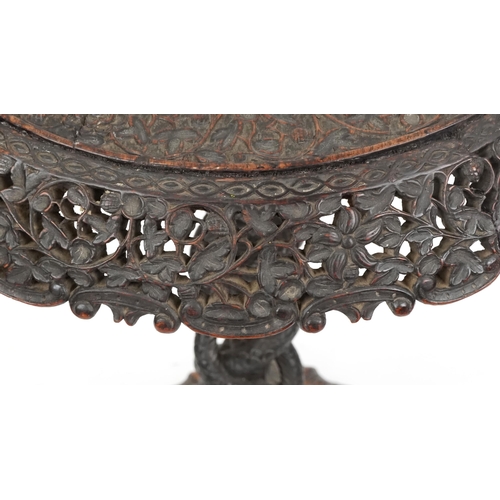  A good 19th century Anglo-Indian carved paddock tip-top centre table, the circular top with a pierce... 