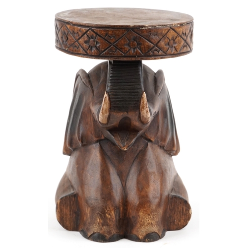 1549 - African carved wood stool in the form of an elephant, 36cm high.