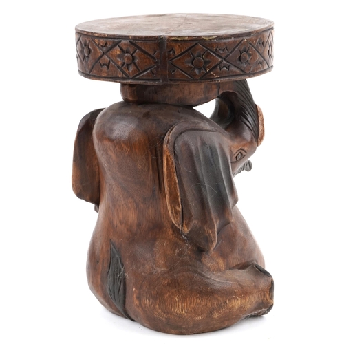 1549 - African carved wood stool in the form of an elephant, 36cm high.