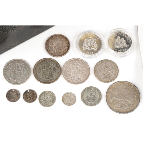 2160 - A quantity of silver coins to include 1935 George V Rocking Horse crown, half crowns, florins togeth... 