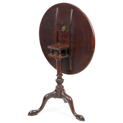 1046 - A late George III mahogany circular tip-top wine table, raised on tripod legs, H-71cm