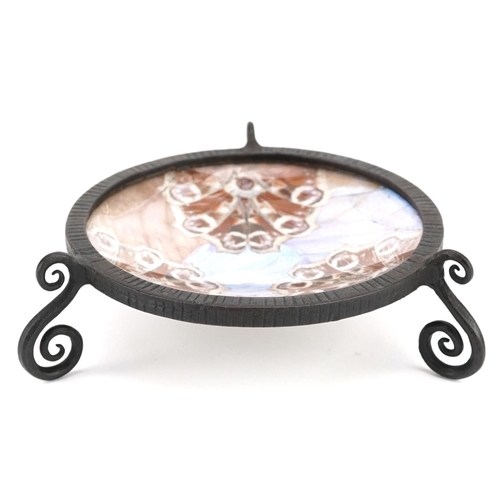 90 - An Art Deco wrought metal circular dish with a butterfly wing inset bowl, diameter 10cm.