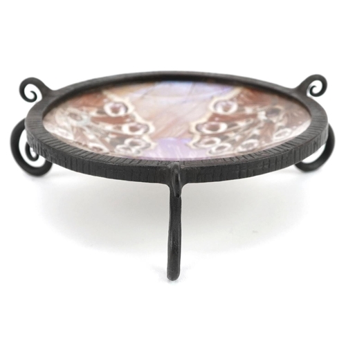 90 - An Art Deco wrought metal circular dish with a butterfly wing inset bowl, diameter 10cm.