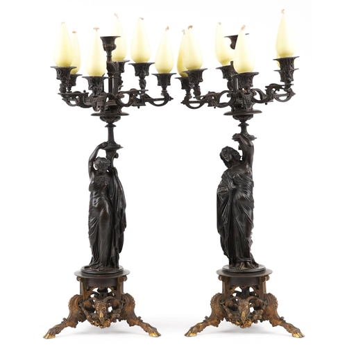  A near pair of 19th century French brown patinated bronze figural candelabras signed Pradier, James ... 