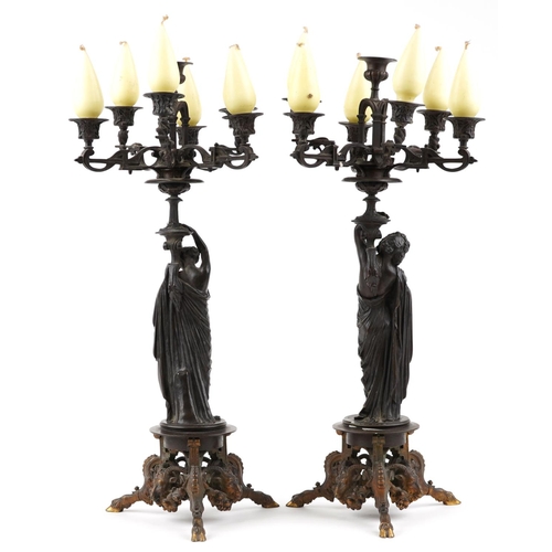  A near pair of 19th century French brown patinated bronze figural candelabras signed Pradier, James ... 