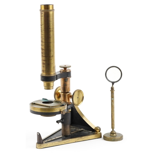 137 - A brass cased microscope by R. & J. Beck, London, no. 4711, in a fitted mahogany box, with a variety... 