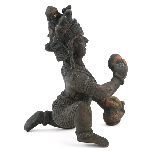 203 - A late 19th/early 20th century Indian bronze figure of a god on one knee, H-10cm.