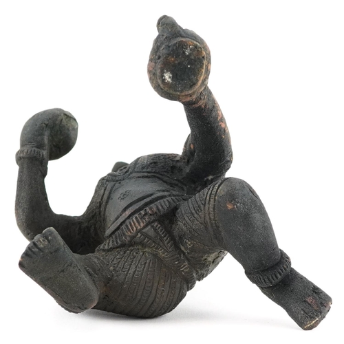 203 - A late 19th/early 20th century Indian bronze figure of a god on one knee, H-10cm.