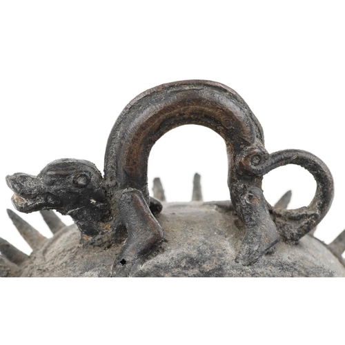 202 - A Tibetan bronze bell shaped gong cast in relief with winged horses and mythical animal suspension, ... 