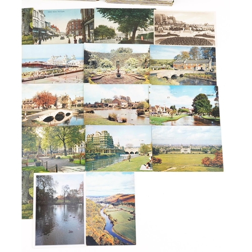 2257 - A collection of approximately four hundred topographic postcards including photographic, colour and ... 