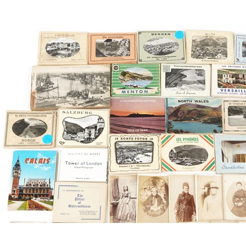 2256 - A collection of tourist travel photograph booklets together with a group of Victorian and later blac... 