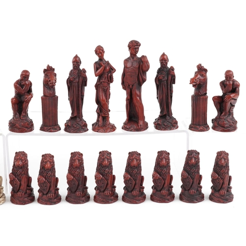 1317 - A modern resin chess set modelled as classical figures, the height of the king 15cm high.