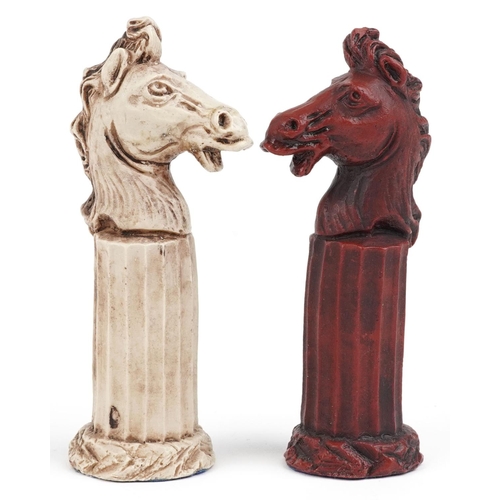 1317 - A modern resin chess set modelled as classical figures, the height of the king 15cm high.