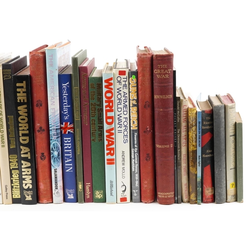 2610 - A large collection of military interest books and collector's reference books including Weapons of W... 